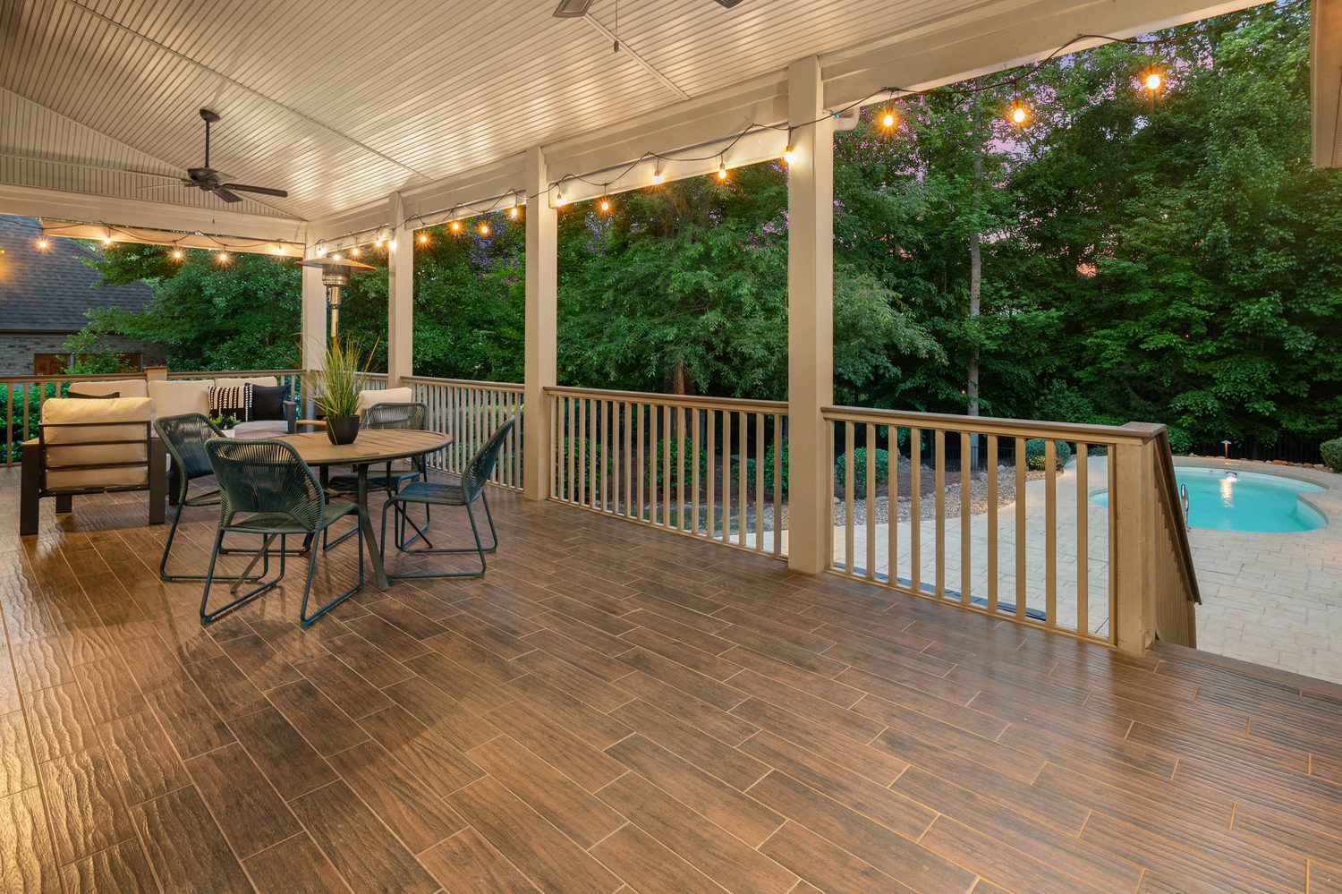 Covered deck with string lights at twilight