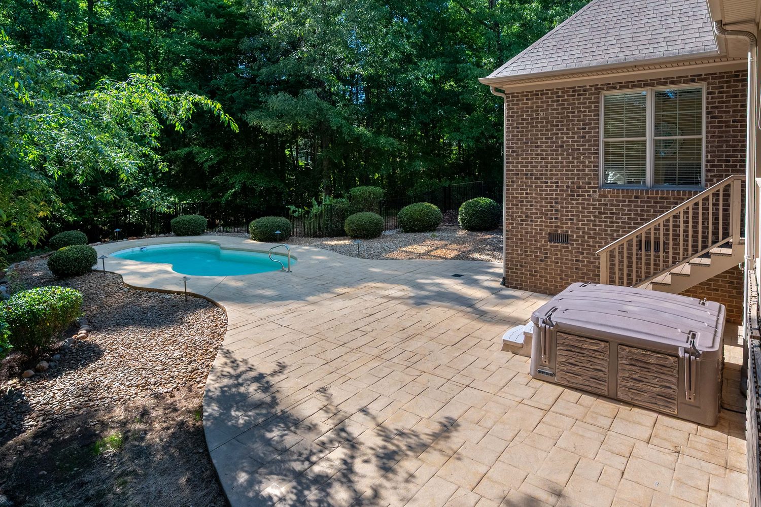 Pool and spa with paver patio