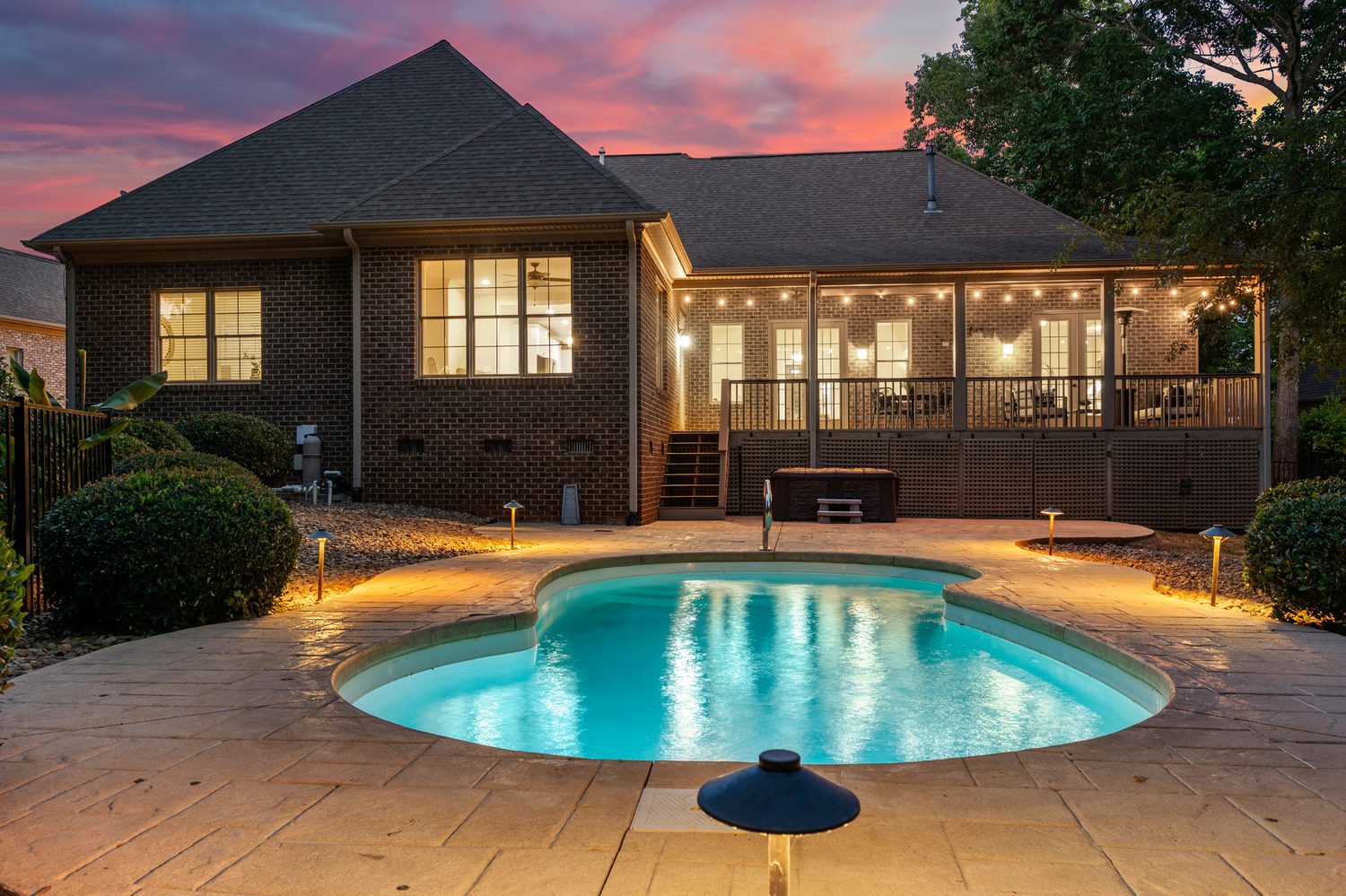 Rear exterior and pool at twilight