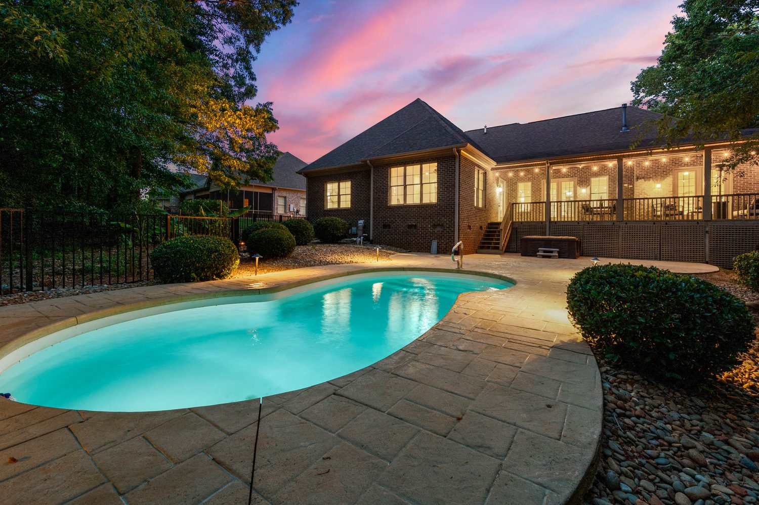 In-ground pool glowing at twilight